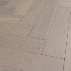 Liberty Floors Pebble Grey Oak - Herringbone Parquet 14mm Engineered Real Wood Flooring (219386) -Flooring Discount Store pebble grey oak herringbone parquet 14mm engineered real wood flooring 219386 p85834 201394 image